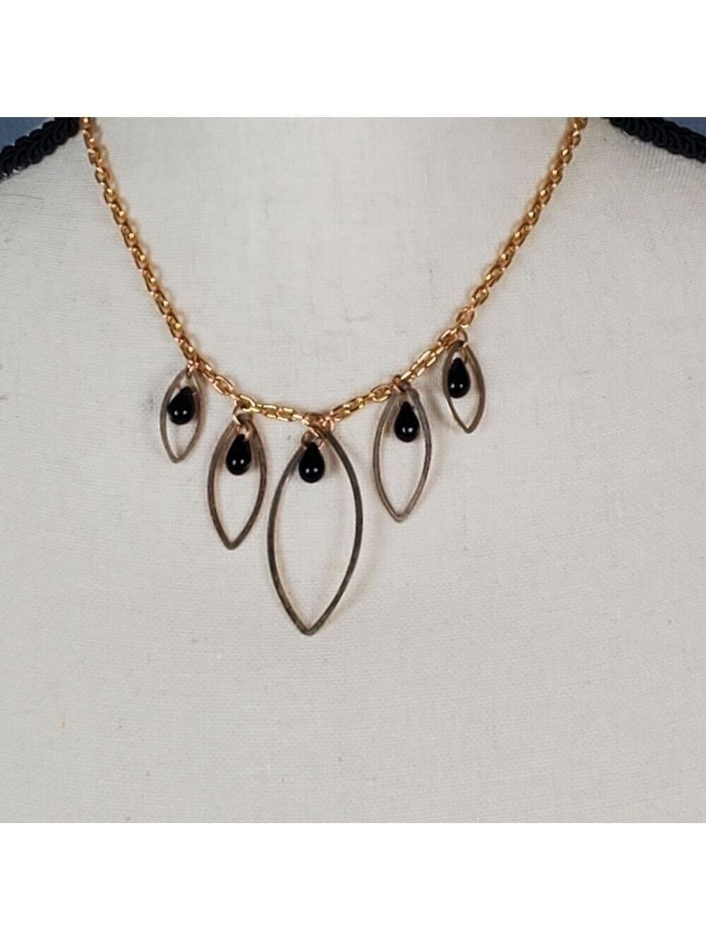 Necklace, gold chain with gold diamonds and black beads